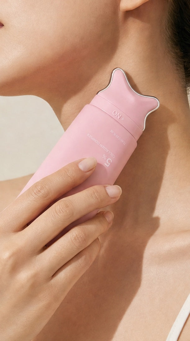 Gliding the gua sha head along the neck